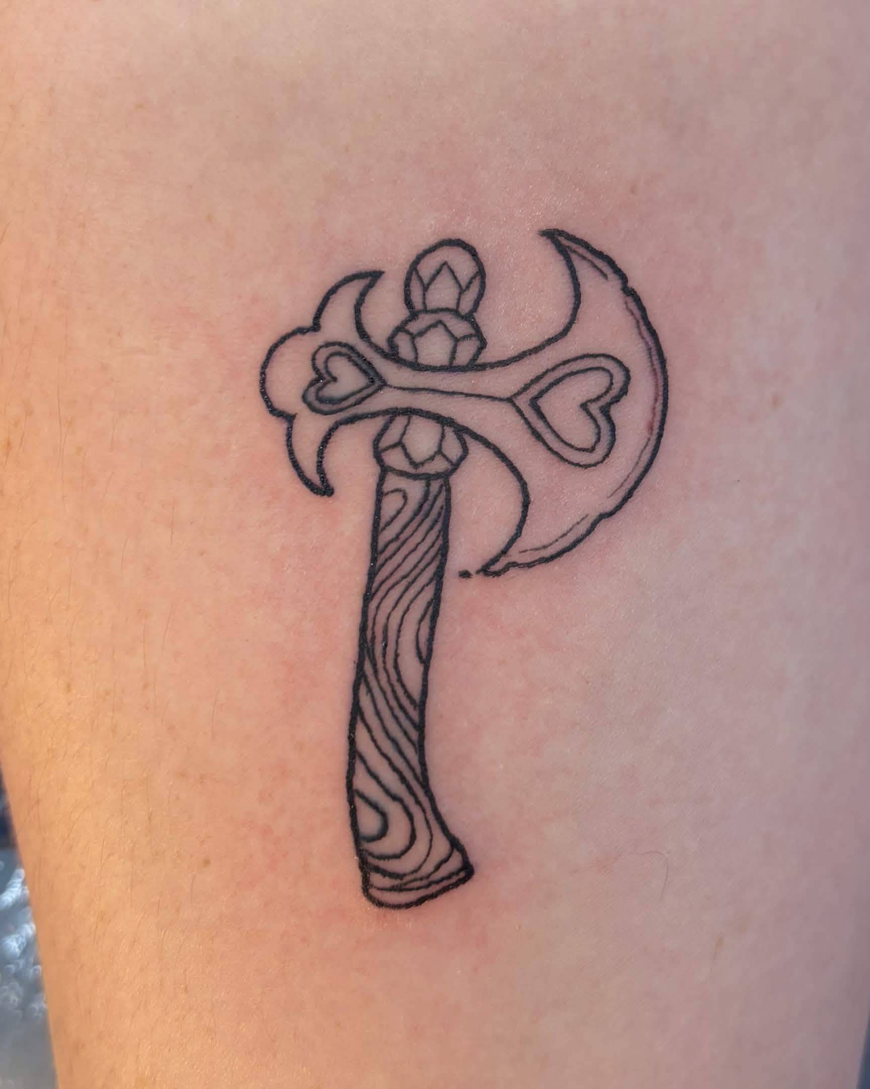 tattoo of small axe with hearts